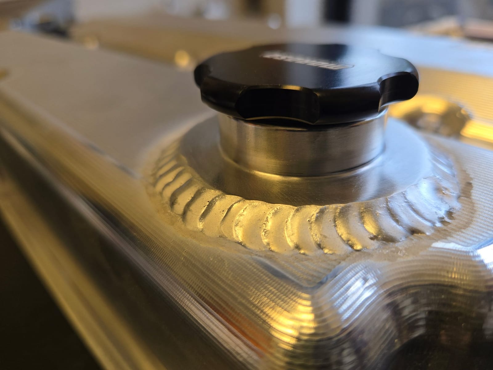 Macro of a stacked-dime TIG aluminum weld bead